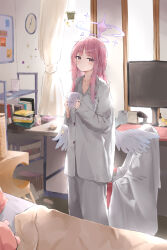  1girl absurdres alternate_costume blue_archive blush book book_stack clock cup feathered_wings halo highres holding holding_cup indoors jsscj keyboard_(computer) long_hair long_sleeves mika_(blue_archive) monitor mug pink_hair plant potted_plant sidelocks sideways_glance sleepwear solo straight_hair tissue very_long_hair wall_clock white_wings whiteboard wings yellow_eyes 
