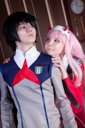  10s 1boy 1girl black_hair blue_eyes cosplay couple darling_in_the_franxx green_eyes hair_ornament hairband hands_on_another&#039;s_shoulders hetero highres hiro_(darling_in_the_franxx) horns long_hair long_sleeves looking_at_another military military_uniform necktie oni_horns orange_neckwear photo_(medium) pink_hair red_horns red_neckwear short_hair uniform white_hairband zero_two_(darling_in_the_franxx)  rating:Sensitive score:0 user:gameart