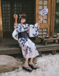  1girl bad_id bad_twitter_id doorway empty_room floral_print hair_between_eyes hands_up highres japanese_clothes leaf long_sleeves looking_to_the_side original outdoors patterned_clothing plant rock short_hair shrine sitting smile solo tifg39 translated tree wide_sleeves 
