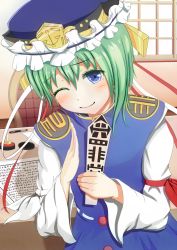  1girl ameto asymmetrical_hair bad_id bad_pixiv_id blue_eyes blush chair green_hair hat hat_ribbon long_sleeves looking_at_viewer one_eye_closed pen ribbon rod_of_remorse shiki_eiki shirt short_hair smile solo table text_focus touhou upper_body vest wide_sleeves window 