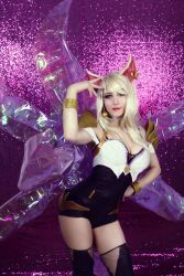  1girl ahri_(league_of_legends) animal_ears blonde_hair breasts cleavage cosplay fox fox_ears fox_tail league_of_legends long_hair looking_at_viewer makeup mowky solo tail thighhighs  rating:Sensitive score:4 user:League_Of_Bitches