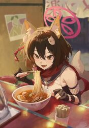  1girl :d animal_ear_fluff animal_ears black_gloves blue_archive blurry bowl chopsticks commentary_request depth_of_field eating eyeshadow fingerless_gloves food fox_ears fox_girl fox_hair_ornament fox_tail gloves hair_between_eyes hair_ornament halo highres holding holding_chopsticks izuna_(blue_archive) leaning_forward looking_at_viewer m.q_(mqkyrie) makeup medium_hair noodles one_side_up open_mouth pom_pom_(clothes) pom_pom_hair_ornament ramen red_eyeshadow rope school_uniform serafuku shimenawa sidelocks smile solo table tail 