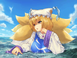  1girl animal_ears animal_hat blonde_hair breasts city cloud commentary_request day dress fox_ears fox_tail frills giant giantess hand_up hat highres large_breasts mob_cap multiple_tails outdoors parted_lips mob_cap pink_eyes short_hair sky smile solo tabard tail teston touhou upper_body white_dress yakumo_ran 