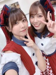  2girls date_sayuri indoors liyuu looking_at_viewer multiple_girls photo_(medium) selfie smile standing voice_actor 