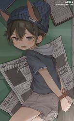  1boy absurdres animal_ears beanie black_hair blue_hat blush bound bound_wrists brown_hair fang grey_shorts hat highres hood hood_down lying male_focus multicolored_hair newspaper omurice_(roza4957) open_mouth original short_sleeves shorts shota signature solo streaked_hair  rating:Sensitive score:88 user:ponekad