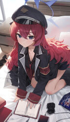  1girl absurdres all_fours armband black_coat black_hat black_shorts blue_archive blue_eyes book breasts cleavage coat gnns halo hat highres indoors iroha_(blue_archive) long_hair looking_at_viewer messy_hair necktie on_bed open_collar peaked_cap red_armband red_hair red_necktie shorts snack solo unworn_socks very_long_hair 