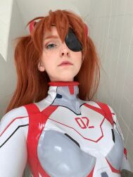 1girl blue_eyes bodysuit brazilian_(nationality) breasts brown_hair cosplay evangelion:_3.0+1.0_thrice_upon_a_time expressionless freckles highres interface_headset lips looking_at_viewer memepantazis neon_genesis_evangelion photo_(medium) plugsuit rebuild_of_evangelion shiny_clothes solo souryuu_asuka_langley souryuu_asuka_langley_(cosplay) standing twintails two_side_up white_bodysuit