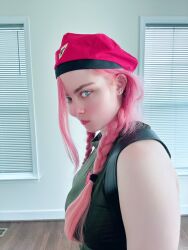 1girl bare_shoulders blue_eyes braid cammy_white cammy_white_(cosplay) cosplay hat highleg highleg_leotard highres indoors leotard long_hair looking_at_viewer musclemommycosplay photo_(medium) pink_hair real_life shiny_clothes sleeveless smile street_fighter twin_braids