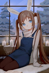  1girl animal_ears arm_support blue_eyes blue_overalls book brown_hair brown_pantyhose candle closed_mouth commentary earmuffs english_commentary fake_animal_ears hairband highres indoors klaeia long_hair looking_at_viewer open_book original overall_skirt overalls pantyhose pine_tree rabbit_ears ribbed_sweater rug sitting sleeves_past_wrists smile snow solo split_mouth sweater tree turtleneck turtleneck_sweater twintails very_long_hair white_hairband white_sweater window wooden_floor yokozuwari 