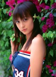  1girl asian blouse breasts brown_hair flower japanese_(nationality) komatsu_ayaka long_hair looking_at_viewer photo_(medium) ribbon shirt solo 