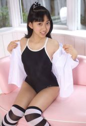  1girl asian black_hair highres japan photo_(medium) solo swimsuit  rating:Sensitive score:19 user:loliliciousness