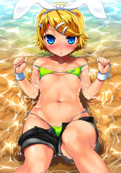  1girl :o alternate_skin_color bad_id bare_shoulders beach bikini black_shorts blonde_hair blue_eyes blurry blush bow breasts depth_of_field dot_nose expressionless facing_viewer female_focus flat_chest foreshortening green_bikini hair_ornament hairclip headband imazon kagamine_rin loli looking_at_viewer micro_bikini navel nose_blush parted_lips partially_submerged partially_undressed short_hair short_shorts shorts small_breasts solo swept_bangs swimsuit tan untied_bikini_top vocaloid water wet wet_clothes white_bow wrist_cuffs 