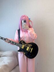  bocchi_the_rock! cosplay gotoh_hitori_(cosplay) gotoh_hitori guitar highres instrument jacket phone photo_(medium) pink_hair selfie source_request track_jacket track_suit  rating:General score:11 user:beenish