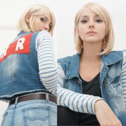  1girl android_18 android_18_(cosplay) belt blonde_hair cosplay cutoffs denim denim_jacket dragon_ball dragonball_z earrings from_behind highres jacket jewelry katiucha_barcelos looking_at_viewer photo_(medium) red_ribbon_army striped swept_bangs  rating:Sensitive score:57 user:pyro_princess_ashley