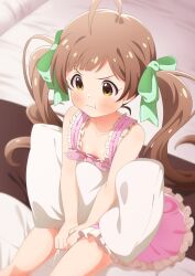  1girl :t ahoge bare_arms bare_shoulders bed_sheet between_legs blurry blush bow breasts brown_eyes brown_hair clenched_hands closed_mouth collarbone commentary_request depth_of_field downblouse dress feet_out_of_frame frilled_dress frills from_above goma_konbu green_bow hair_bow hair_spread_out hakozaki_serika hand_between_legs highres holding holding_pillow idolmaster idolmaster_million_live! indoors lone_nape_hair long_hair looking_ahead on_bed pillow pink_bow pink_dress pout sitting sleeveless sleeveless_dress small_breasts solo swept_bangs tareme thighs three_quarter_view twintails v-shaped_eyebrows v_arms very_long_hair 