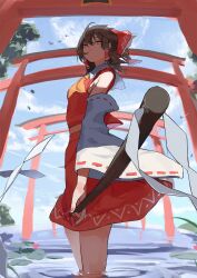  1girl ascot bare_shoulders bow breasts brown_eyes brown_hair closed_mouth cowboy_shot day detached_sleeves gohei hair_between_eyes hair_bow hair_tubes hakurei_reimu highres holding holding_gohei japanese_clothes medium_hair nontraditional_miko orange_ascot outdoors perspective pocche-ex red_bow red_skirt ribbon-trimmed_sleeves ribbon_trim sidelocks skirt small_breasts solo torii touhou wading water white_sleeves wide_sleeves 