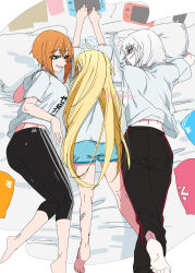  3girls absurdres ahoge alternate_costume bandaid bandaid_on_leg barefoot black_pants blonde_hair blue_eyes blue_shorts breasts casual commentary crossed_legs drake_(nikke) full_body goddess_of_victory:_nikke grey_shirt grin highres knees_together_feet_apart laplace_(nikke) large_breasts long_hair looking_at_another lying matis_(nikke) maxwell_(nikke) midriff multiple_girls nikumanman nintendo_switch notice_lines on_bed on_side on_stomach orange_hair outstretched_arms pants parted_lips pillow shirt short_hair short_shorts shorts smile soles sweatpants tight_clothes tight_pants translated twitter_username white_hair 