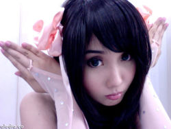  1girl alodia_gosiengfiao cosplay female_focus flower gradient_background hair_ornament hairclip long_hair lowres photo_(medium) solo upper_body white_background  rating:Questionable score:4 user:jhonfordy