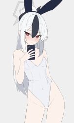  1girl absurdres alternate_costume animal_ears arm_behind_back bare_shoulders black_hair blue_archive blush breasts bright_pupils cameltoe cellphone covered_navel cowboy_shot double-parted_bangs fake_animal_ears genso_(thereisnosauce) gluteal_fold grey_background grey_halo hair_between_eyes halo hand_up highleg highleg_leotard highres holding holding_phone kayoko_(blue_archive) leotard long_hair phone playboy_bunny ponytail rabbit_ears red_eyes sidelocks simple_background small_breasts smartphone solo white_hair white_leotard  rating:Questionable score:17 user:danbooru