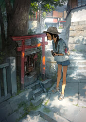 1girl absurdres architecture backpack bag bag_charm bare_legs black_eyes black_hair blue_bag blue_shorts braid camera charm_(object) closed_mouth day east_asian_architecture expressionless full_body hat highres holding holding_camera lantern low_twin_braids original outdoors paper_lantern profile sandals scenery shade shirt short_shorts shorts shrine sidelocks sleeves_past_elbows solo stairs standing torii tree twin_braids white_footwear white_hat white_shirt yoshida_seiji