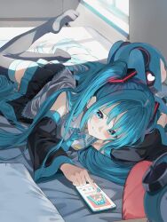  1girl alarm_clock aqua_nails black_skirt black_thighhighs blue_eyes blue_hair blue_necktie blush cellphone character_doll clock closed_mouth collared_shirt commentary_request detached_sleeves frilled_shirt frills grey_shirt hatsune_miku highres indoors light_particles long_hair long_sleeves lying nail_polish necktie no_shoes on_bed on_stomach pentagon_(railgun_ky1206) phone pillow pleated_skirt shirt sidelocks skirt smartphone solo thighhighs twintails very_long_hair vocaloid wide_sleeves window 