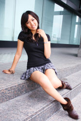  1girl asian black_hair highres legs looking_at_viewer miniskirt outdoors photo_(medium) sayaka sitting skirt smile solo tagme  rating:Sensitive score:13 user:Kum⑨