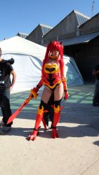  1girl absurdres armor cosplay erza_scarlet fairy_tail flame_empress_armor highres photo_(medium) red_hair sword weapon  rating:Sensitive score:8 user:radamantys4371