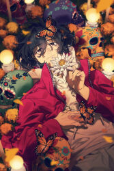  1boy absurdres black_eyes black_hair bug butterfly calavera candle closed_mouth constantine_xi_(fate) dia_de_muertos drawstring earrings fate/grand_order fate_(series) fingernails flower flower_request grey_pants highres hood hooded_sweater insect jacket jewelry light_particles long_sleeves looking_at_viewer lying male_focus messy_hair monarch_butterfly on_back orange_butterfly orange_flower pants petals red_jacket shooou_0104 short_hair sweater white_flower white_sweater 