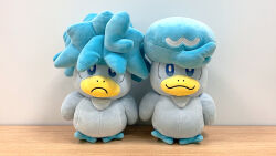 bird blue_eyes blue_hair closed_mouth creatures_(company) frown game_freak messy_hair nintendo no_humans official_art photo_(medium) pokemon pokemon_(creature) quaxly smile stuffed_animal stuffed_toy