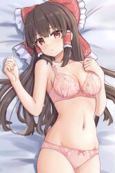  1girl absurdres blush bow bra breasts brown_hair cleavage closed_mouth commentary_request cowboy_shot floral_print forneus_0 groin hair_bow hair_tubes hakurei_reimu highres lingerie long_hair looking_at_viewer lying medium_breasts navel on_back on_bed panties pink_bra pink_panties red_bow red_eyes sidelocks solo touhou underwear  rating:Sensitive score:16 user:danbooru