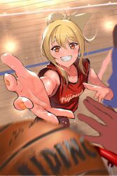  1girl 2others ball basketball basketball_(object) basketball_court basketball_hoop basketball_uniform blonde_hair blurry blurry_foreground check_commentary collarbone commentary_request grin highres jersey jyon looking_at_viewer love_live! love_live!_nijigasaki_high_school_idol_club medium_hair miyashita_ai multiple_others orange_eyes orange_nails ponytail red_shirt shirt sidelocks smile sportswear sweat upper_body 