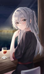 Rule 34 | 1girl, absurdres, black shirt, blue eyes, blush, city lights, closed mouth, cup, expressionless, grey hair, hand up, highres, indoors, long hair, looking at viewer, looking back, night, night sky, original, ponytail, shirt, short sleeves, sitting, sky, solo, table, tess (88884), water, window