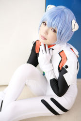 Rule 34 | 1girl, asian, ayanami rei, blue hair, color contacts, cosplay, hairpods, highres, looking at viewer, namada, neon genesis evangelion, parted lips, photo (medium), plugsuit, plugsuit (cosplay), red eyes, short hair, sitting, solo