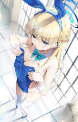 Rule 34 | 1girl, adjusting clothes, animal ears, bare shoulders, blonde hair, blue archive, blue eyes, blue halo, blue leotard, bow, breasts, cleavage, detached collar, dutch angle, fake animal ears, gyoku seisyoku, halo, highres, leotard, long hair, official alternate costume, playboy bunny, rabbit ears, solo, standing, strapless, strapless leotard, thighhighs, toki (blue archive), toki (bunny) (blue archive), white thighhighs