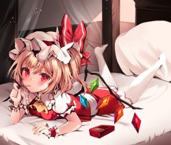 Rule 34 | 1girl, ascot, blonde hair, blush, flandre scarlet, food, hat, hat ribbon, highres, looking at viewer, lying, mob cap, mouth hold, on bed, on stomach, pantyhose, pillow, pocky, puffy short sleeves, puffy sleeves, red eyes, red skirt, red vest, ribbon, shirt, short sleeves, skirt, solo, touhou, vest, white hat, white pantyhose, white shirt, wings, wrist cuffs, yellow ascot, zerocat