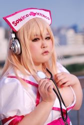 Rule 34 | 1girl, asian, breasts, cosplay, large breasts, nitroplus, photo (medium), pink eyes, pink hair, plump, replica doll, solo, super sonico, super sonico (cosplay)