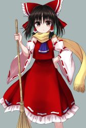 Rule 34 | 1girl, :/, armpit crease, arms up, ascot, black hair, blue ascot, bow, broom, cowboy shot, detached sleeves, expressionless, grey background, hair bow, hair tubes, hakurei reimu, hand on own hip, highres, holding, holding broom, kayon (touzoku), looking at viewer, medium hair, red eyes, red skirt, ribbon-trimmed sleeves, ribbon trim, scarf, simple background, skirt, solo, standing, touhou, yellow scarf