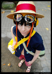 Rule 34 | 1girl, a-pumpkin, bag, black hair, blue eyes, cosplay, fall, goggles, hat, leaf, monkey d. luffy, monkey d. luffy (cosplay), moss, navel, one piece, one piece: strong world, open clothes, open shirt, outdoors, photo (medium), sandals, scar, shirt, smile, straw hat, t-shirt