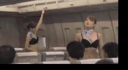 Rule 34 | 2girls, aircraft, airplane, airplane interior, animated, animated gif, asian, ass, black bra, black panties, bra, breasts, exhibitionism, flight attendant, lace, lace-trimmed panties, lace trim, lingerie, lowres, multiple boys, multiple girls, panties, photo (medium), public indecency, scarf, sdde-339, sod create, thighhighs, thong, travel attendant, tray, underwear