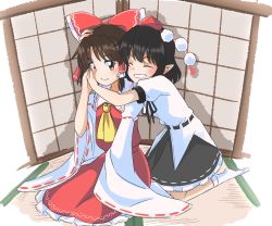 Rule 34 | 2girls, black hair, black ribbon, black skirt, bow, brown eyes, brown hair, commentary, closed eyes, fisheye, grin, hair bow, hair tubes, hakurei reimu, hand on another&#039;s cheek, hand on another&#039;s face, hat, highres, holding hands, hug, hug from behind, indoors, multiple girls, neck ribbon, on floor, pointy ears, red bow, ribbon, seiza, shameimaru aya, sidelocks, sitting, skirt, smile, tatami, tokin hat, touhou, white legwear, yakousei no kame, yellow neckwear