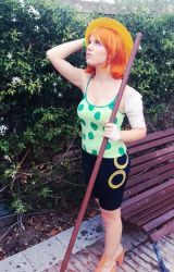 Rule 34 | 1girl, camisole, cosplay, nami (one piece), nami (one piece) (cosplay), one piece, orange hair, photo (medium), shorts, solo, staff