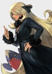 Rule 34 | 1girl, black coat, black pants, black sclera, black shirt, blonde hair, coat, colored sclera, creatures (company), cynthia (pokemon), eyelashes, fangs, fangs out, from below, fur trim, game freak, garchomp, gen 4 pokemon, hair ornament, hair over one eye, hand on own hip, hand up, hungry clicker, lips, long coat, long hair, long sleeves, nintendo, pants, parted lips, pokemon, pokemon (creature), pokemon dppt, shirt, simple background, upper body, very long hair, yellow eyes