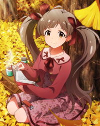 Rule 34 | 10s, 1girl, artist request, autumn leaves, book, brown eyes, brown hair, character name, hair ribbon, hakozaki serika, idolmaster, idolmaster million live!, kneeling, leaf, looking at viewer, official art, ribbon, smile, solo, twintails