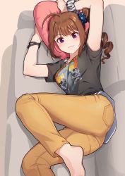 Rule 34 | 1girl, :3, ahoge, arms up, ass, barefoot, black shirt, blue scrunchie, blunt bangs, breasts, brown hair, closed mouth, clothes writing, commentary request, couch, drill hair, feet, feet out of frame, from above, hair ornament, hair scrunchie, heart, heart-shaped pillow, holding, holding pillow, idolmaster, idolmaster million live!, indoors, kamille (vcx68), leg up, light blush, looking at viewer, lying, medium breasts, medium hair, on couch, on side, pants, pillow, pocket, print scrunchie, print shirt, purple eyes, scrunchie, shirt, short sleeves, side ponytail, sidelocks, skull print, smile, solo, star (symbol), star print, striped clothes, striped scrunchie, white scrunchie, wrist scrunchie, wristband, yellow pants, yokoyama nao