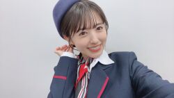 Rule 34 | 1girl, aida rikako, flight attendant, indoors, looking at viewer, photo (medium), selfie, smile, standing, travel attendant, voice actor
