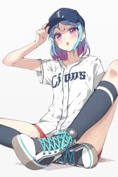 1girl aikatsu!_(series) aikatsu_friends! baseball_cap baseball_uniform black_socks blue_hair blue_hat blush clothes_writing commentary_request gradient_hair hand_on_headwear hand_up hat highres kneehighs knees_apart_feet_together looking_at_viewer minato_mio multicolored_hair nippon_professional_baseball nokita_(pinmisil) open_mouth purple_eyes purple_hair saitama_seibu_lions shirt shoes short_sleeves shorts simple_background sitting sneakers socks solo sportswear white_shirt