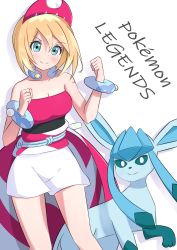 Rule 34 | 1girl, absurdres, bare arms, bare shoulders, blonde hair, bracelet, breasts, cleavage, clenched hands, closed mouth, collarbone, commentary, creatures (company), english text, game freak, gen 4 pokemon, glaceon, green eyes, hair between eyes, hair ornament, hand up, highres, irida (pokemon), jewelry, legs apart, looking at viewer, neck ring, nintendo, pokemon, pokemon (creature), pokemon legends: arceus, shadow, short hair, shorts, simple background, smile, toes, white background, white shorts, yoshiwo senpai
