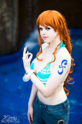 Rule 34 | 1girl, bracelet, breasts, cosplay, flaming-goddess, highres, jewelry, large breasts, nami (one piece), nami (one piece) (cosplay), one piece, orange hair, photo (medium), solo, tattoo