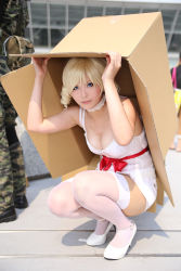 Rule 34 | 1girl, artist request, bare shoulders, blonde hair, blue eyes, blurry, bow, box, breasts, cardboard box, catherine, catherine (game), choker, cleavage, cosplay, depth of field, dress, drill hair, high heels, lace, lace choker, looking at viewer, makeup, medium breasts, outdoors, photo (medium), red bow, short dress, sleeveless, sleeveless dress, solo, squatting, thighhighs, twin drills, white dress, white footwear, white heels, white thighhighs, zettai ryouiki