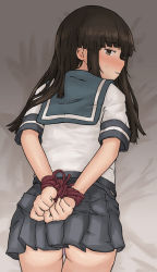 Rule 34 | 1girl, arms behind back, ass, black hair, blush, bound, bound wrists, brown eyes, chagamaka, from behind, hatsuyuki (kancolle), highres, hime cut, kantai collection, looking back, lying, miniskirt, on stomach, pleated skirt, robe, school uniform, serafuku, skirt, smile, solo, sweat